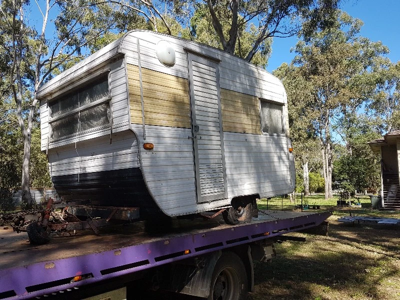 Vintage caravan sitting on a tilt tray