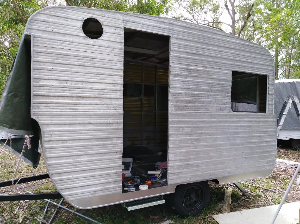 Exterior of 40 year old caravan stripped back ready for renovation