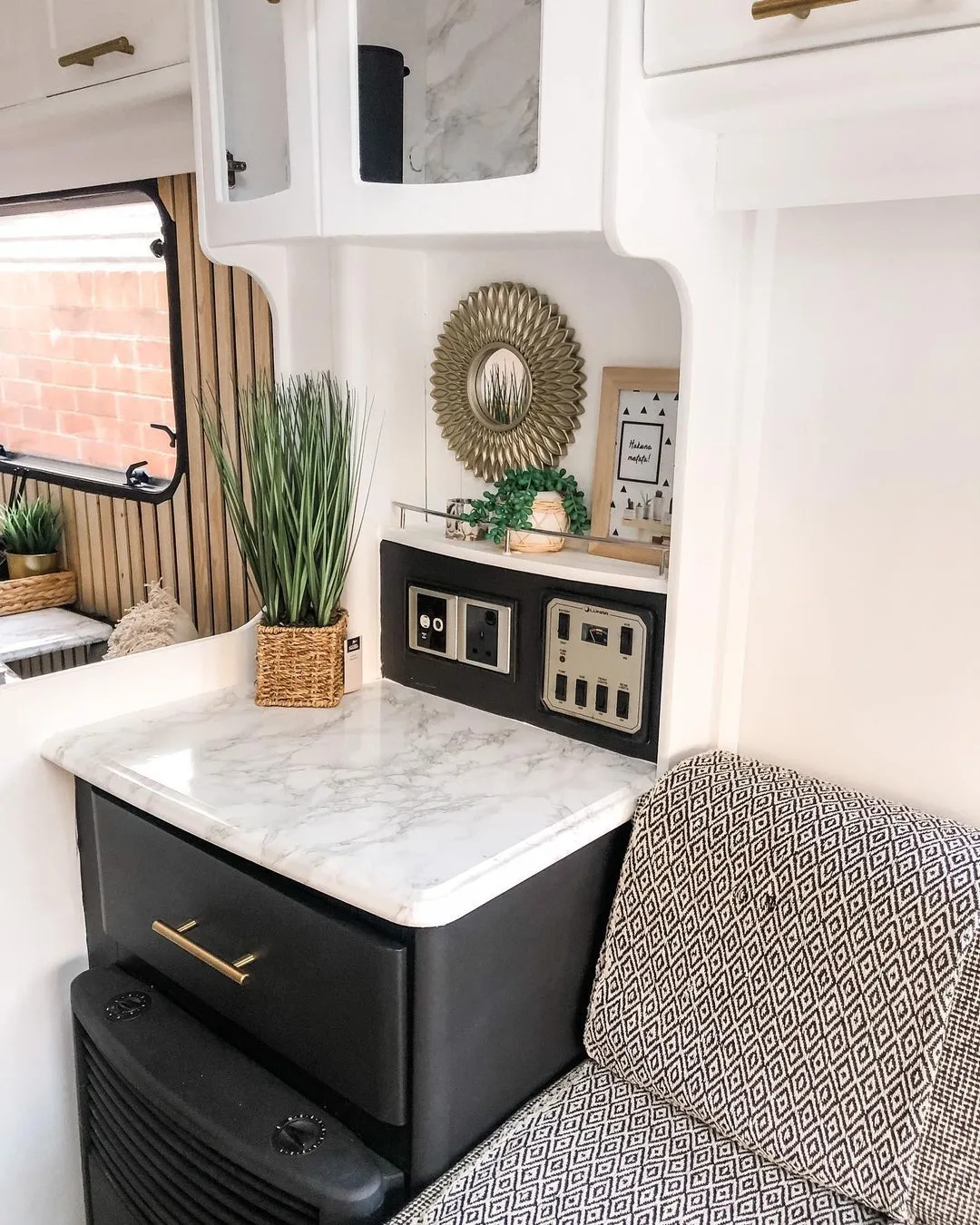 Decor details in a renovated caravan showing a new countertop.