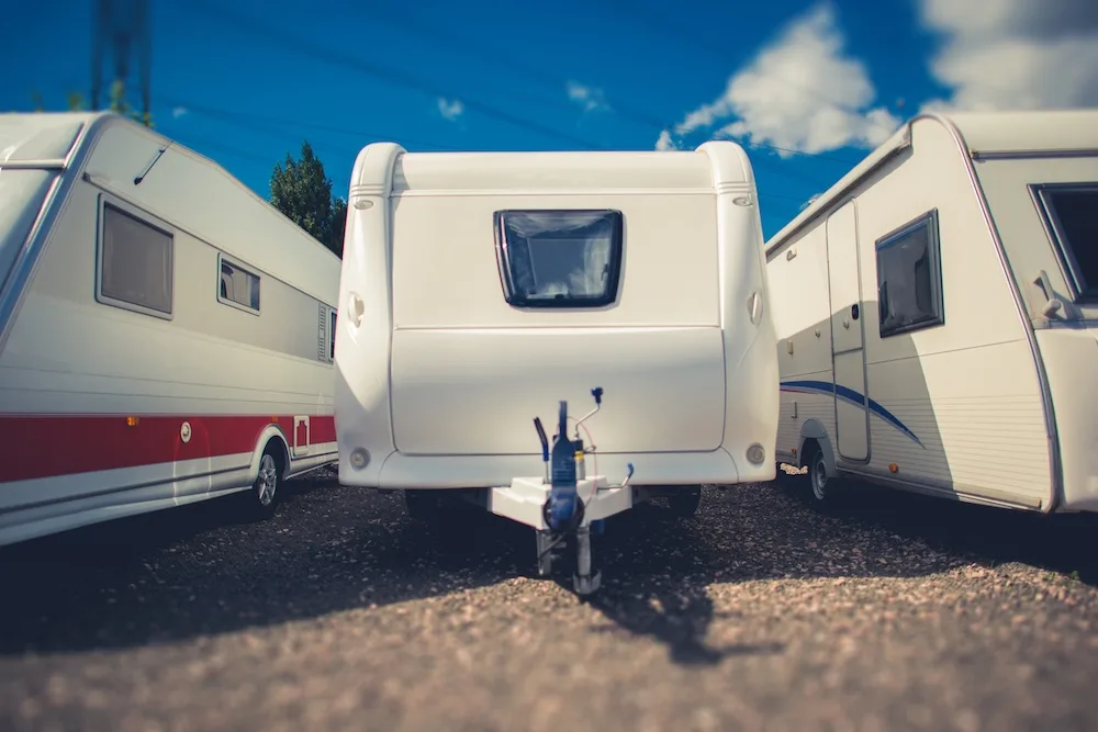 Caravan parked on the hard in an RV lot.