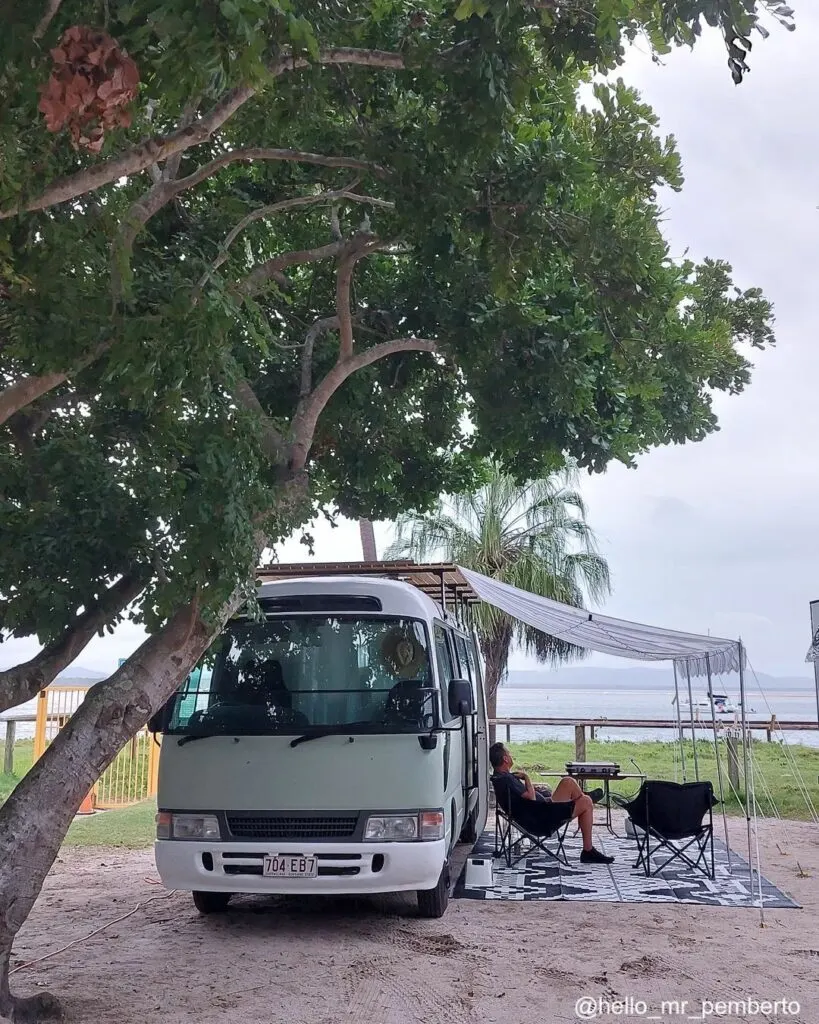 Front view of a converted camper van Toyota Coaster.